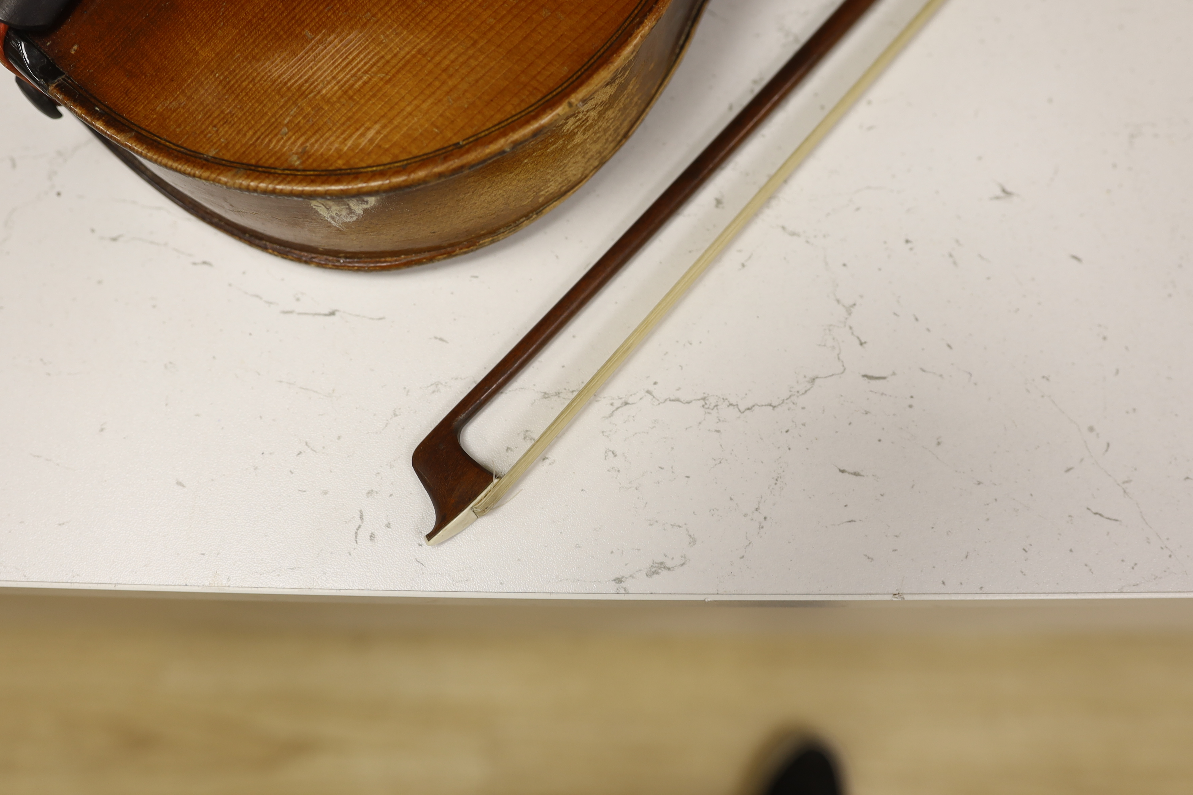 A German Strad violin, back measures 39.5cm, with bow